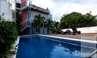 Foto de inmueble en Edificio de Departamentos y Locales Comerciales  en Venta en  Zona Centro Playa del Carmen, Col. Playa del Carmen Centro C.P. 77710, Solidaridad